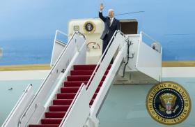 President Joe Biden waves from the steps of Air Force One - source: White House photo