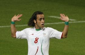 Iran's Ali Karimi, wearing green wristbands at a 2010 World Cup qualifier - source: Reuters