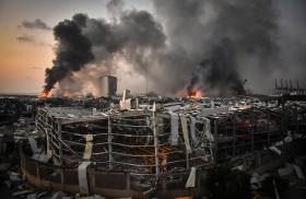 Fires burn after the August 2020 port explosion in Beirut - source: Reuters