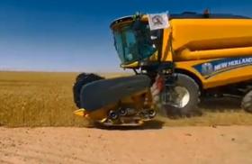 PMF logo on a Muhandis General Company combine harvester