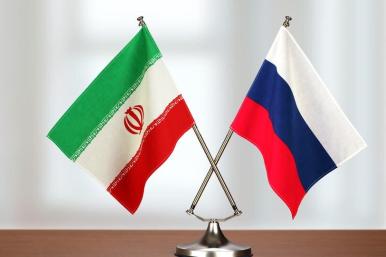 Iranian and Russian flags on a table